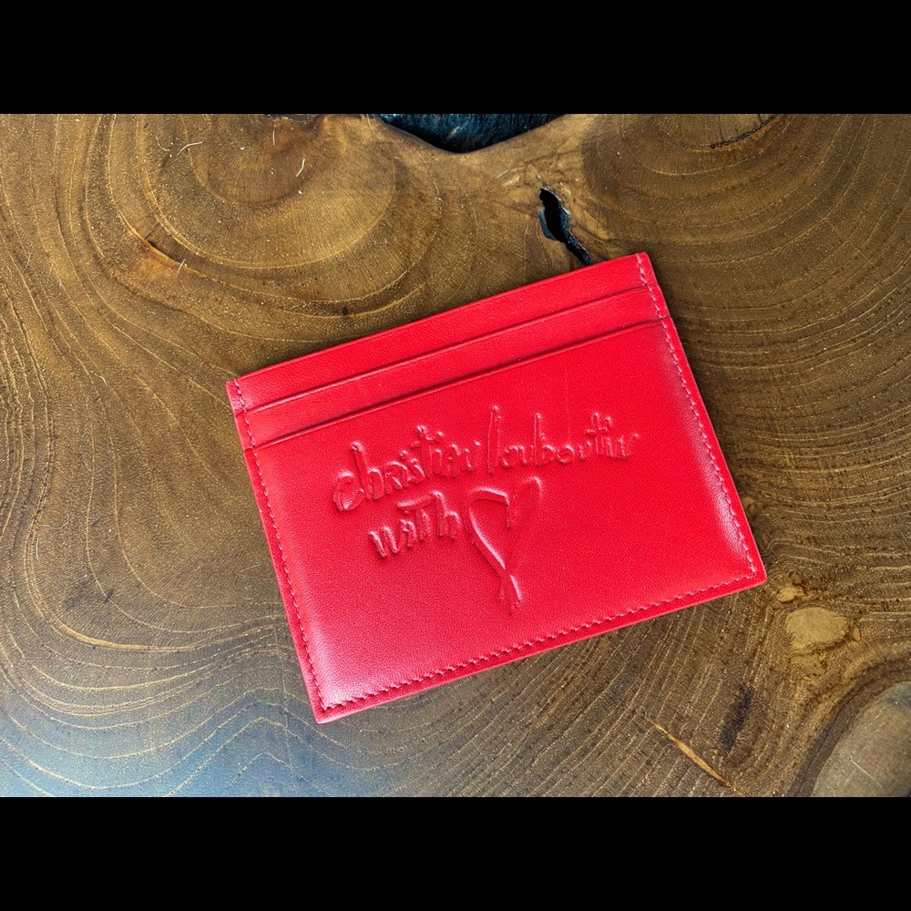 New (without tags or box) Red Leather Christian Louboutin card holder.